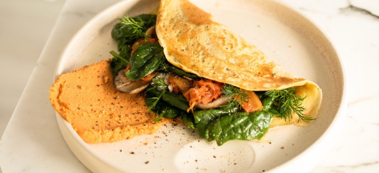 an omelette with fillings on a bowl